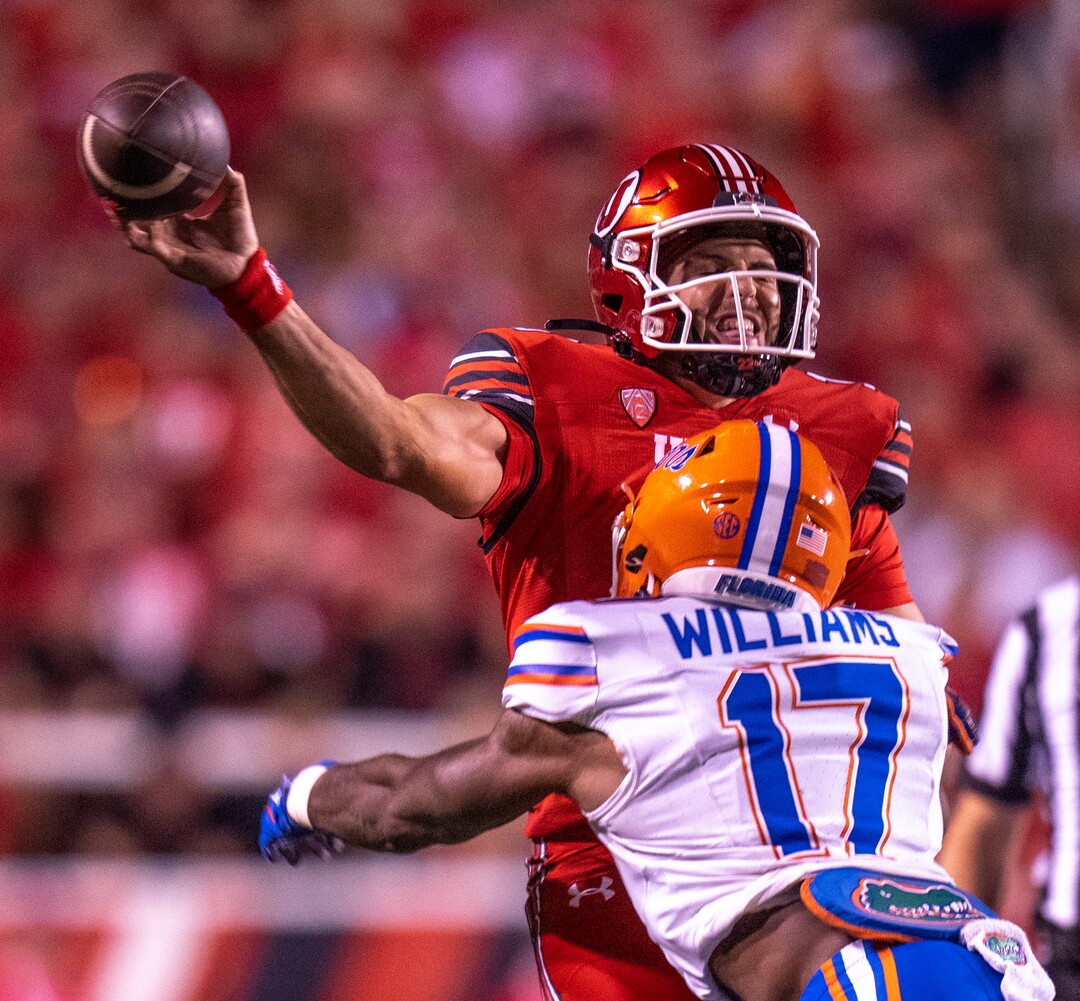(Rick Egan | The Salt Lake Tribune) Quarterback Bryson Barnes (16) is hit by Florida Gators linebacker Scooby Williams (17) as he releases the ball, in football action between the Utah Utes and the Florida Gators. At Rice-Eccles Stadium, on Thursday, Aug. 31, 2023.
