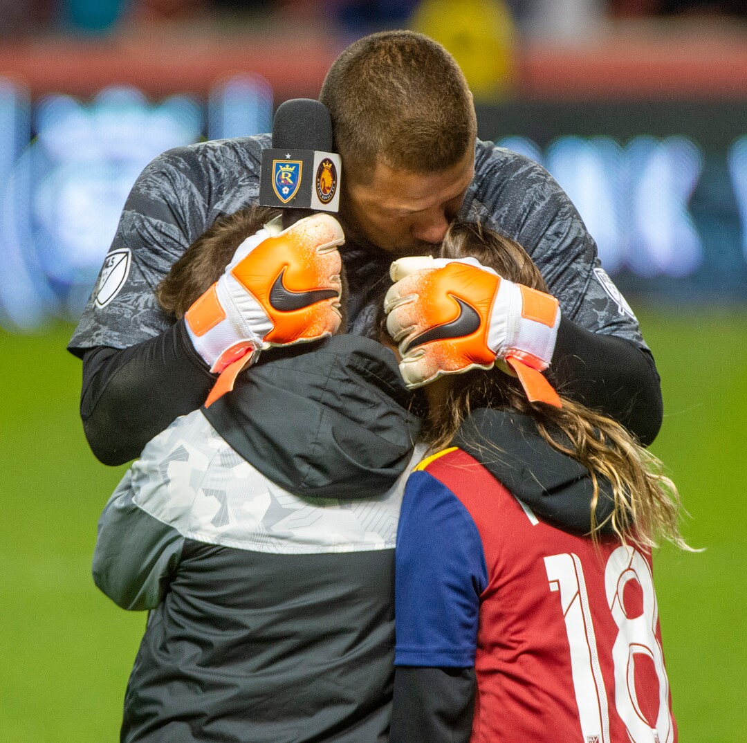 (Rick Egan  |  The Salt Lake Tribune)      An emotional Nick Rimando (18) hugs his kids Ben and Jett, after saying goodbye to the crowd after Real Salt Lake defeated the Houston Dynamo 2-1 in his last regular season home game for Real Salt Lake, in MLS soccer action, at Rio Tinto Stadium, Sunday, Sept. 29, 2019.