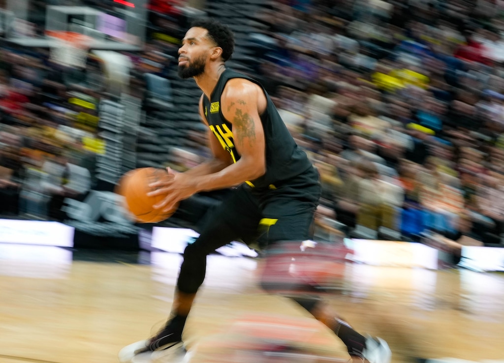 (Francisco Kjolseth | The Salt Lake Tribune) Utah Jazz guard Mike Conley (11) looks for the shot as the Utah Jazz take on the Miami Heat in NBA basketball at Vivint Arena in Salt Lake City on Saturday Dec. 31, 2022.