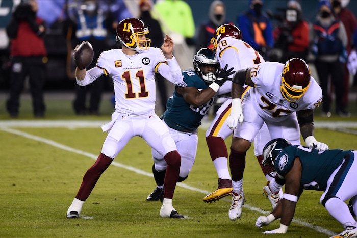 Washington Football Team's Alex Smith plays during the first half of an NFL football game against the Philadelphia Eagles, Sunday, Jan. 3, 2021, in Philadelphia. Alex Smith is the biggest reason Washington became the first team in the Super Bowl era to start 2-7 and make the playoffs. The 36-year-old’s journey back from a broken leg and 17 surgeries was a long one, but the difference with him at quarterback has been simple: Smith doesn’t make major mistakes, manages the game and is the cool hand coach Ron Rivera wanted in control of his young team. (AP Photo/Derik Hamilton, File)