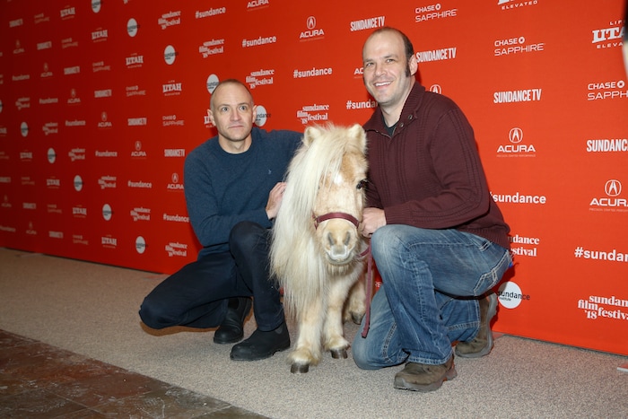 A miniature horse named Daisy, who appears in the film as a character named Butterscotch, poses with poses as directors, screenwriters and actors David Zellner, left, and Nathan Zellner, right, at the premiere of "Damsel" during the 2018 Sundance Film Festival on Tuesday, Jan. 23, 2018, in Park City, Utah. (Photo by Danny Moloshok/Invision/AP)