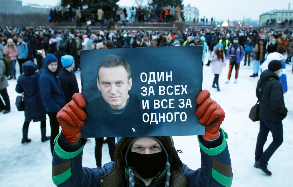 (AP Photo/Dmitri Lovetsky, File)
In a Jan. 23 photo, a man holds a poster with a portrait Alexei Navalny and reads: 'One for all and all for one', during a protest rally against the jailing of opposition leader Alexei Navalny in St. Petersburg, Russia. Allies of Navalny are calling for new protests next weekend to demand his release, following a wave of demonstrations across the country that brought out tens of thousands in a defiant challenge to President Vladimir Putin.
