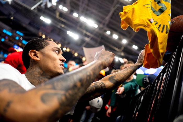 (Trent Nelson  |  The Salt Lake Tribune) Jordan Clarkson sign autographs as the Utah Jazz host the Portland Trail Blazers, NBA basketball in Salt Lake City on Thursday, Dec. 26, 2019.