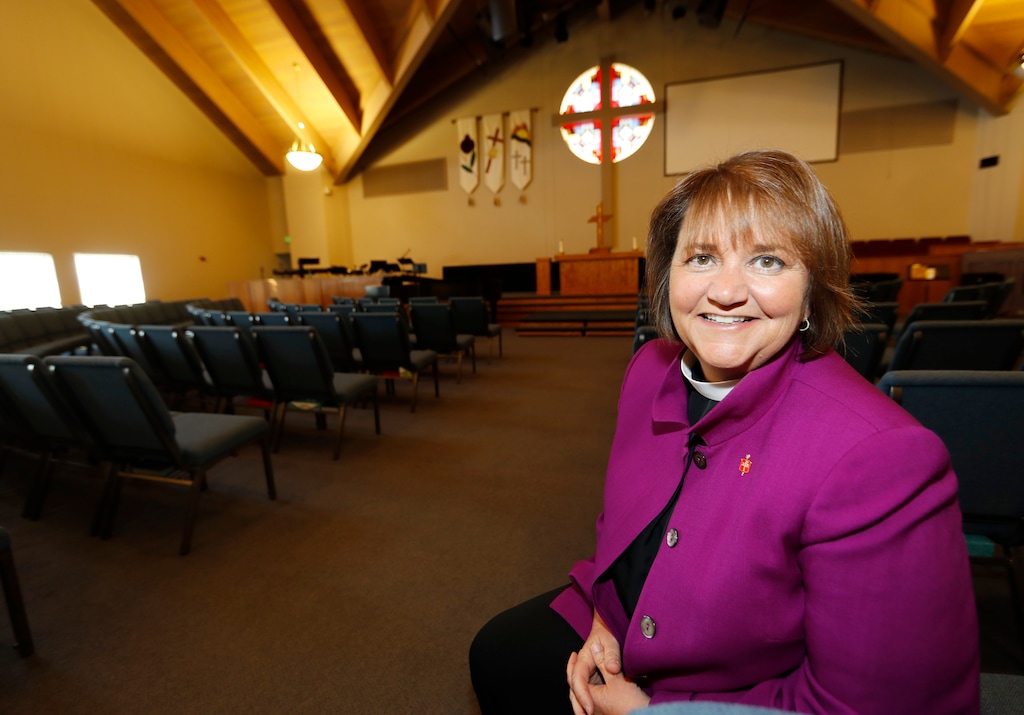 (AP Photo/David Zalubowski) This Wednesday, April 19, 2017, photo shows Bishop Karen Oliveto in the sanctuary of a United Methodist Church near her office in Highlands Ranch, Colo. She will be speaking Sunday in Salt Lake City.