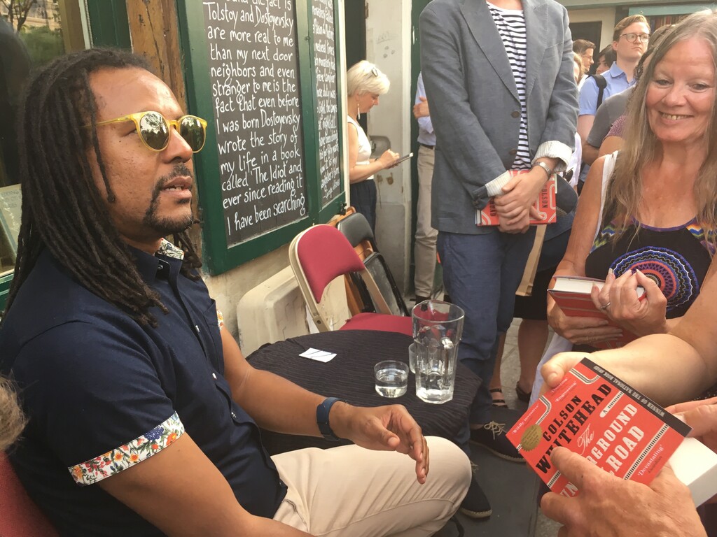 (Russell Contreras | AP file photo) Novelist Colson Whitehead speaks to fans after discussing his Pulitzer prize-winning book "The Underground Railroad" at the English-language bookstore Shakespeare and Company in Paris in June 2017.