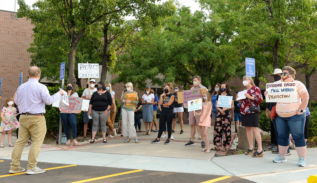 (Chris Samuels | The Salt Lake Tribune) People participate at a rally advocating mask use in schools outside the Utah Board of Education building, Friday, Aug. 6, 2021.