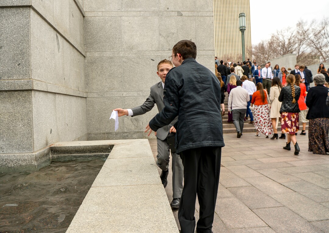 Leah Hogsten  |  The Salt Lake Tribune  A young boy who accidentally dropped his ticket from the building's bridge retrieves it from the fountain prior to the afternoon session of the 189th Annual General Conference of The Church of Jesus Christ of Latter-day Saints, April 6, 2019 in Salt Lake City. 