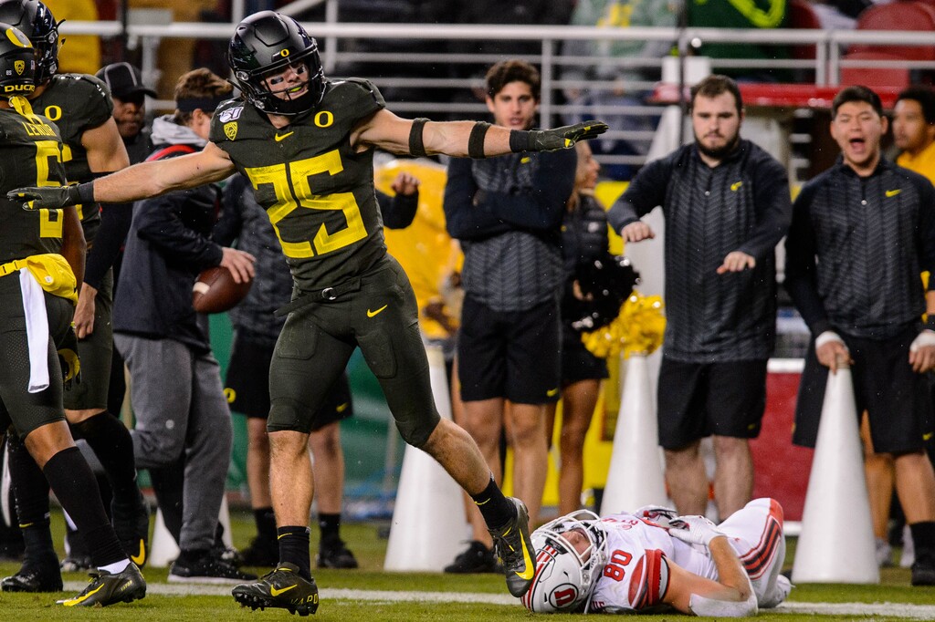 (Trent Nelson | Tribune file photo) Oregon Ducks safety Brady Breeze (25) signals incomplete over Utah Utes tight end Brant Kuithe (80) in the Pac-12 football championship game in Santa Clara, Calif., on Friday Dec. 6, 2019. The Utes' loss ended their hopes of making it into the College Football Playoff.