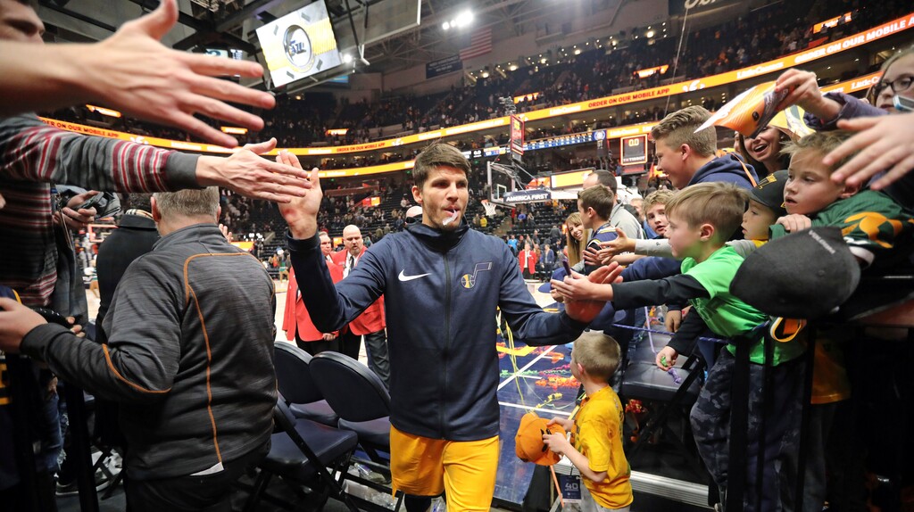 Fans reach for Utah Jazz guard Kyle Korver following their NBA basketball game against the San Antonio Spurs Tuesday Dec. 4, 2018, in Salt Lake City. (AP Photo/Rick Bowmer)