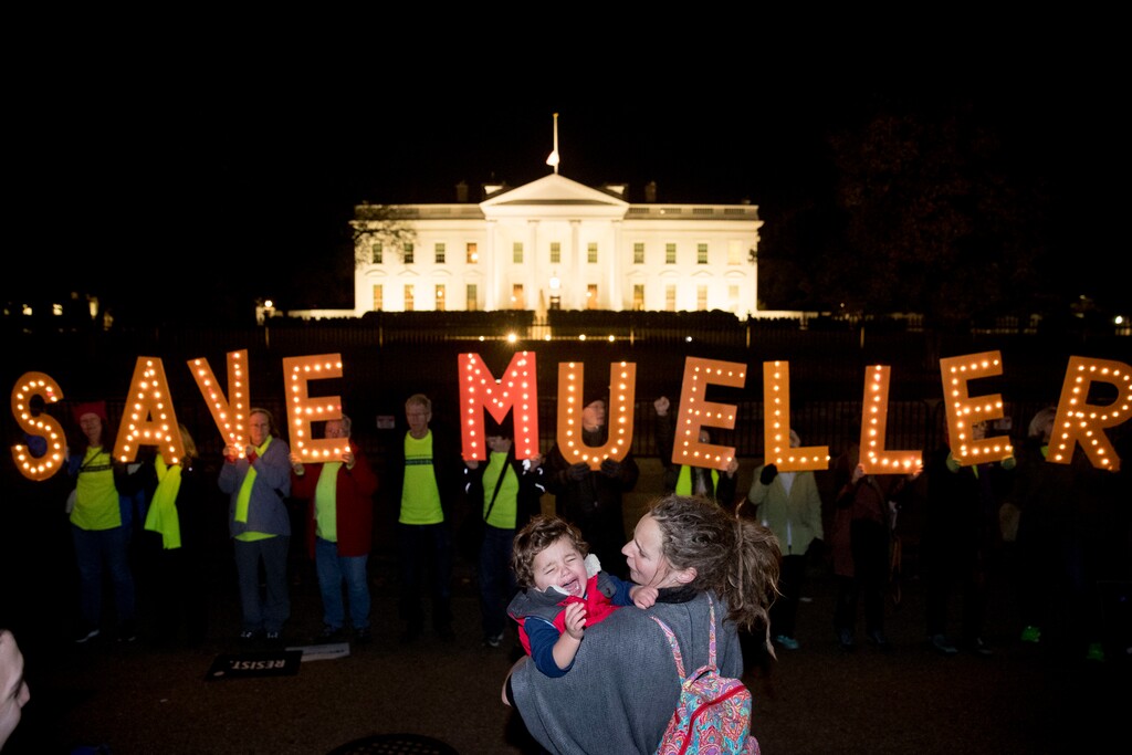 Protesters gather in front of the White House in Washington, Thursday, Nov. 8, 2018, as part of a nationwide "Protect Mueller" campaign demanding that Acting U.S. Attorney General Matthew Whitaker recuse himself from overseeing the ongoing special counsel investigation. (AP Photo/Andrew Harnik)