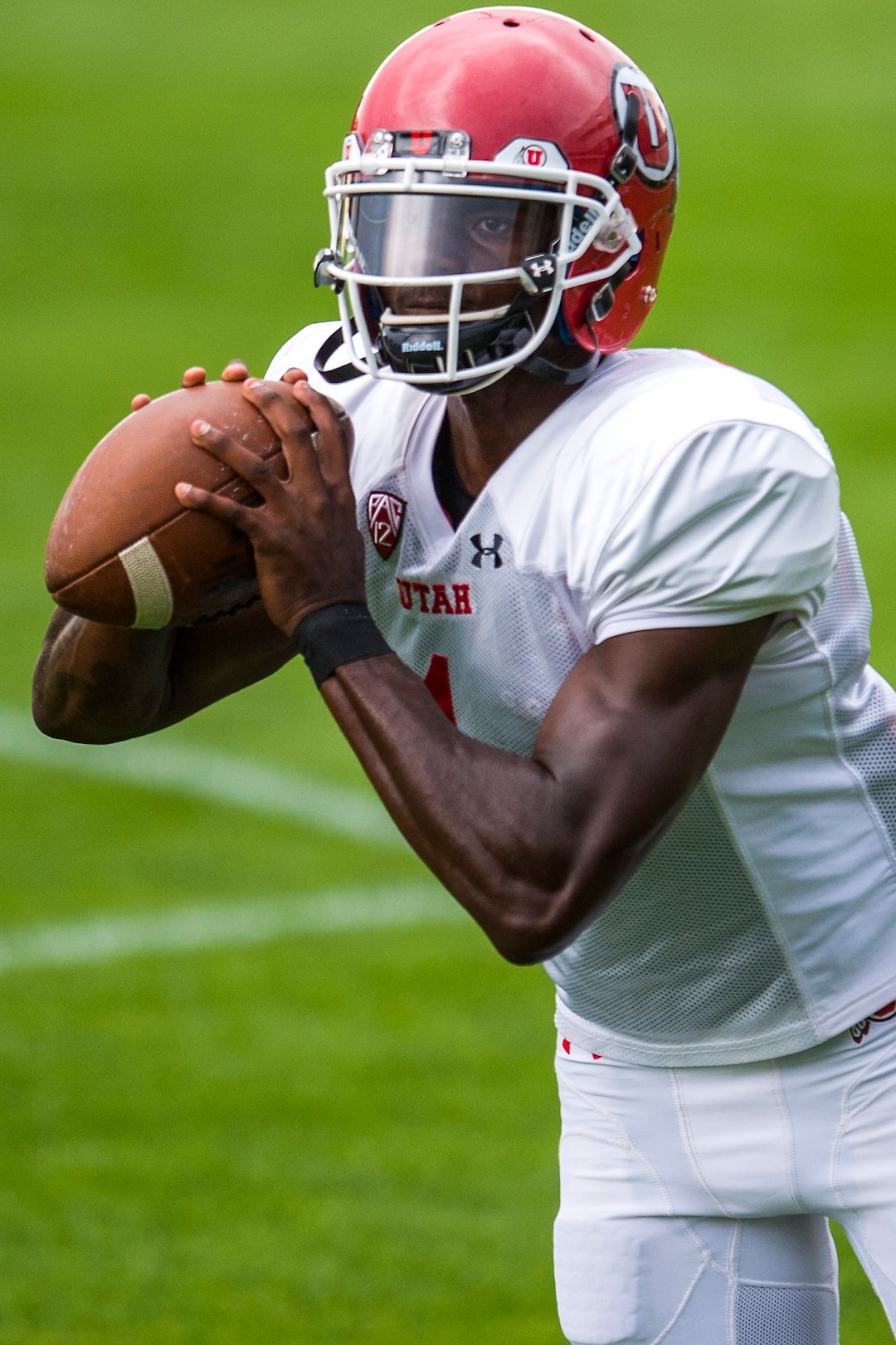 (Chris Detrick  |  The Salt Lake Tribune) Utah Utes quarterback Tyler Huntley (1) throws the ball during practice Tuesday, August 22, 2017. 