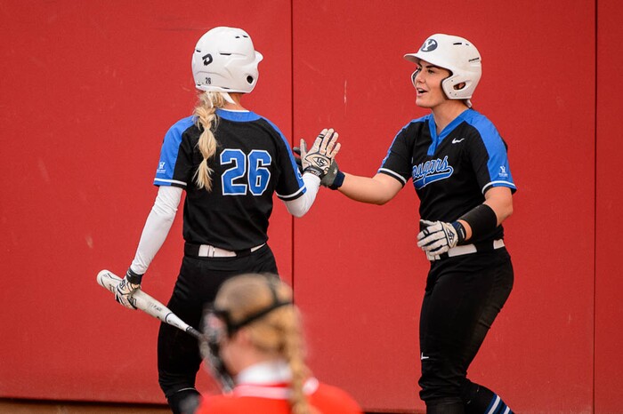 (Trent Nelson | The Salt Lake Tribune)  Utah Utes host the BYU Cougars, NCAA softball in Salt Lake City, Wednesday April 18, 2018. BYU outfielder Lexi Tarrow (26) and BYU catcher Libby Sugg (21) celebrate.