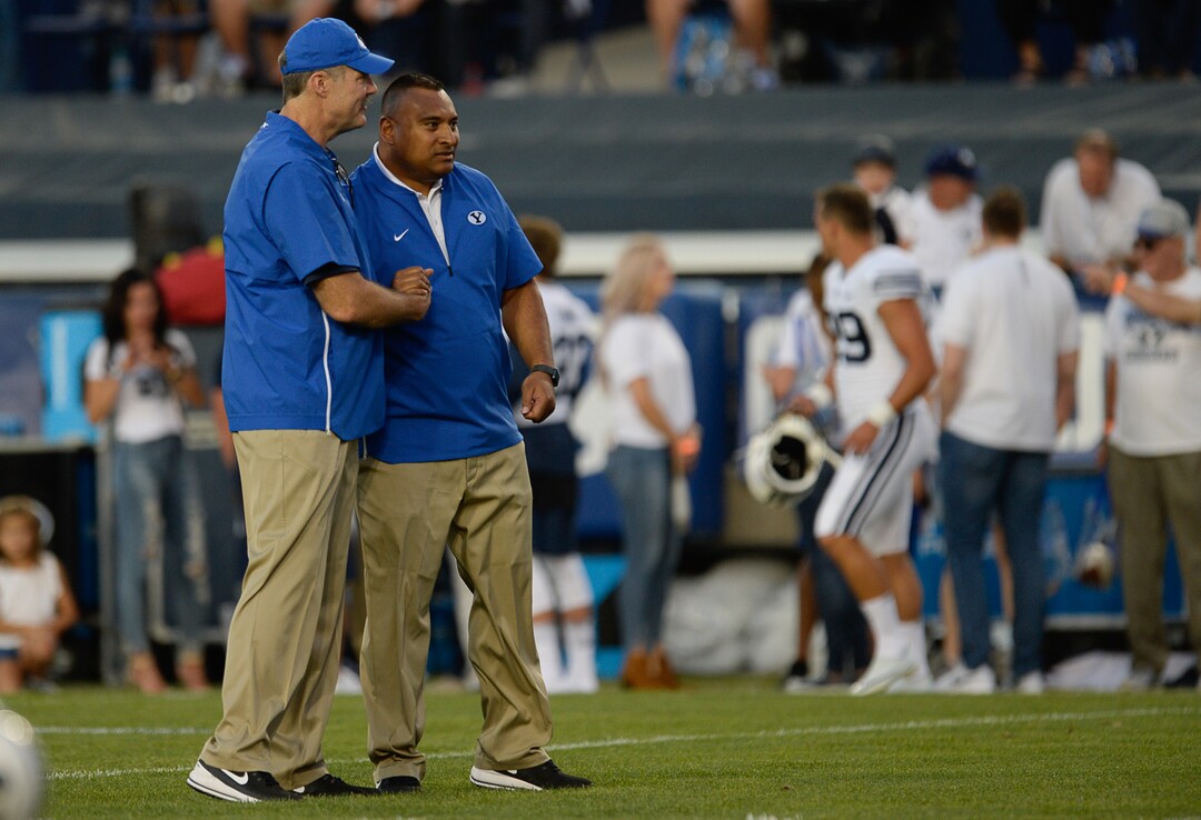 (Francisco Kjolseth  |  The Salt Lake Tribune)  BYU offensive coordinator Jeff Grimes and head coach Kalani Sitake take to the field during takes to the field before their game against California in the NCAA college football game, Saturday, Sept. 8, 2018, at LaVell Edwards stadium in Provo, Utah.