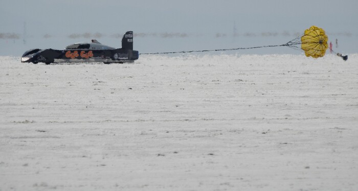 (Francisco Kjolseth  |  The Salt Lake Tribune)  Slowed down by parachute a car finishes a run during Speed Week at the Bonneville Salt Flats outside Wendover on Monday, Aug. 14, 2017.