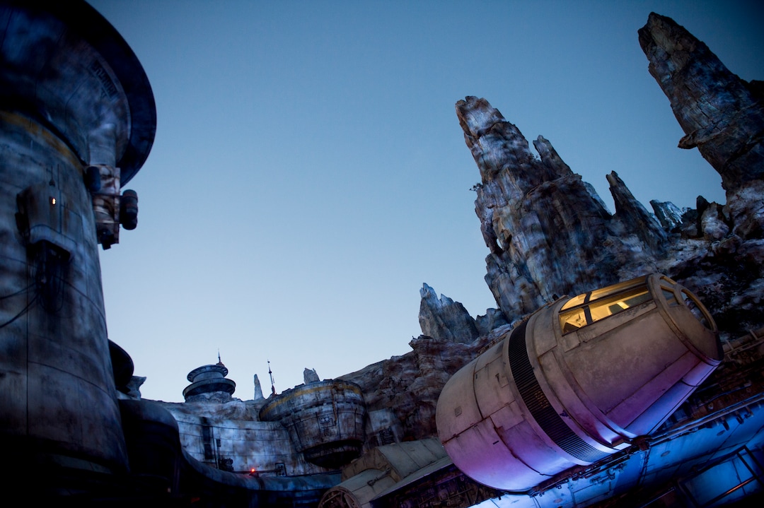(Jeremy Harmon  |  The Salt Lake Tribune) The Millennium Falcon and the rest of Black Spire Outpost is bathed in eerie blue light after the sun set over at Star Wars: Galaxy's Edge in Anaheim, Ca. on Wednesday, May 29, 2019.