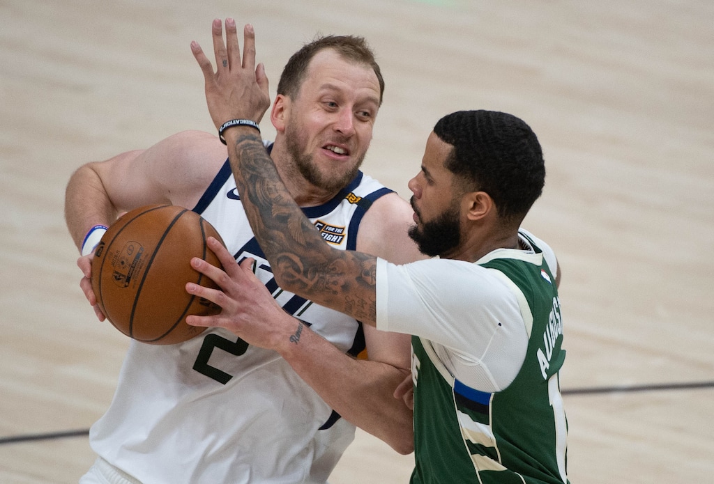 (Francisco Kjolseth | The Salt Lake Tribune) Utah Jazz forward Joe Ingles (2) is pressured by Milwaukee Bucks guard D.J. Augustin (12) as the Utah Jazz take on the Milwaukee Bucks at Vivint Smart Home Arena in Salt Lake City, on Friday, Feb. 12, 2021.