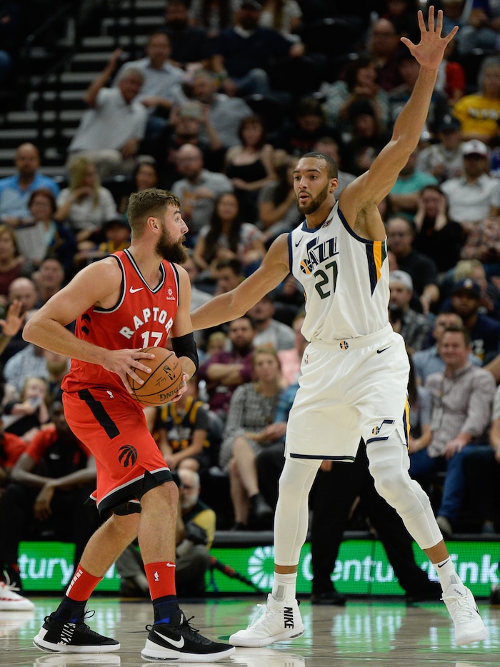 (Francisco Kjolseth  |  The Salt Lake Tribune)  Toronto Raptors center Jonas Valanciunas (17) faces the wingspan of Utah Jazz center Rudy Gobert (27) in the first half of the preseason NBA game at Vivint Smart Home Arena Tuesday, Oct. 2, 2018, in Salt Lake City.