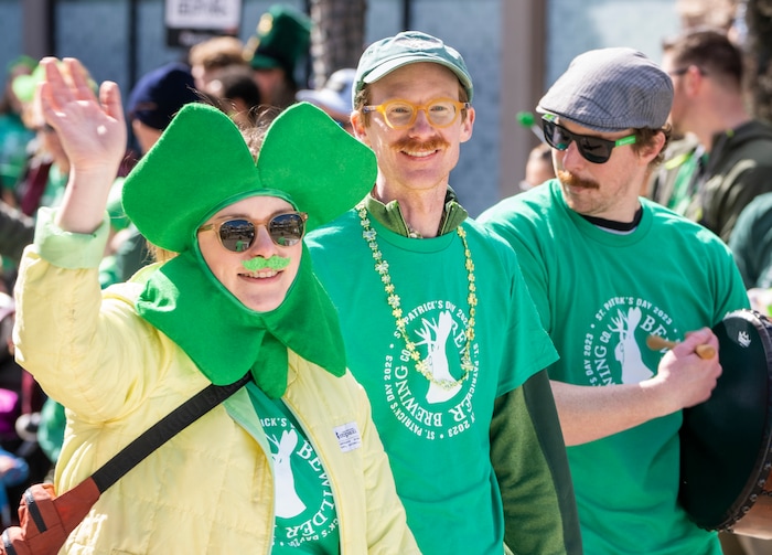 (Rick Egan | The Salt Lake Tribune) Participants dressed in green march in the Saint Patrick's Day Parade at the Gateway on Saturday, March 11, 2023.