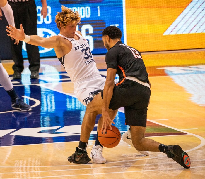 (Rick Egan | The Salt Lake Tribune) Pacific Tigers forward Jeremiah Bailey (13)  collides with Brigham Young Cougars forward Caleb Lohner (33) in basketball action at the Marriott Center in Provo, on Saturday, Jan. 30, 2021.