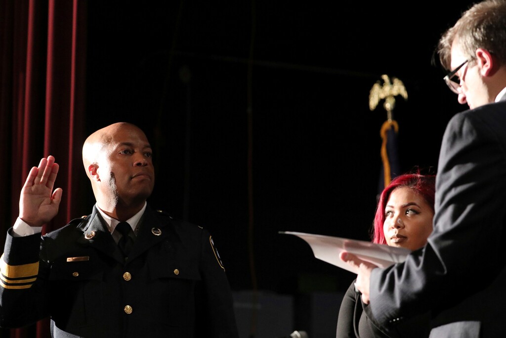 (Anthony Souffle | Star Tribune via AP, file photo) - In this Sept. 8, 2017, photo, newly appointed Minneapolis Police Chief Medaria Arradondo takes the oath of office as his daughter Nyasia looks on during a public swearing-in ceremony, in Minneapolis. A majority of the members of the Minneapolis City Council said Sunday they support disbanding the city’s police department after the death of George Floyd.