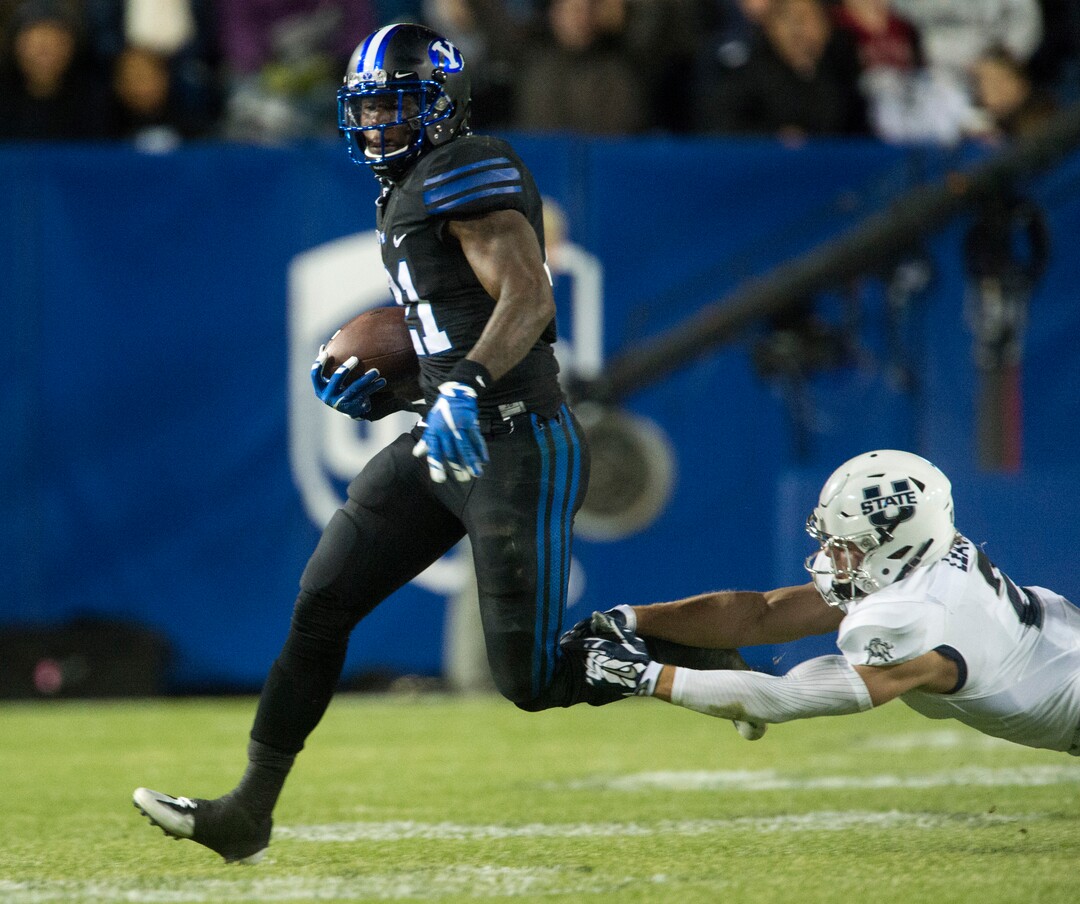 Rick Egan  |  The Salt Lake TribuneBrigham Young running back Jamaal Williams (21) runs the ball for the Cougars, in football action, BYU vs Utah State, at Lavell Edwards Stadium in Provo,  Saturday, November 26, 2016.