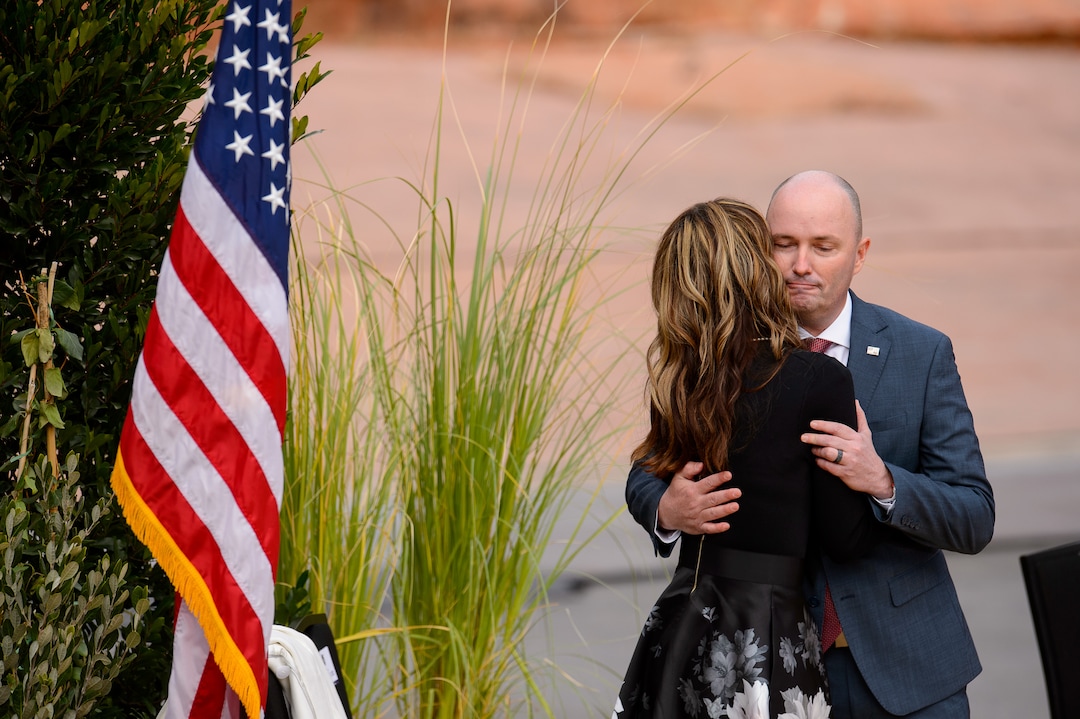 (Trent Nelson  |  The Salt Lake Tribune)  Spencer Cox embraces his wife Abby Cox after being sworn in as Utah's 18th governor at Tuacahn Center for the Arts in Ivins on Monday, Jan. 4, 2021.