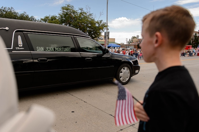 (Trent Nelson | The Salt Lake Tribune)  Crowds line Main Street in Monticello to honor the motorcade of fallen soldier Aaron Butler, who was killed last week in Afghanistan, , Thursday August 24, 2017.