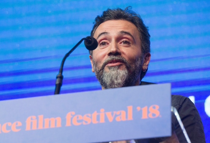 (Rick Egan  |  The Salt Lake Tribune)     Talal Derki accepts the Cinema Grand Jury Prize: Documentary Award, at the 2018 Sundance Film Festival Awards Night, Saturday, January 27, 2018.


