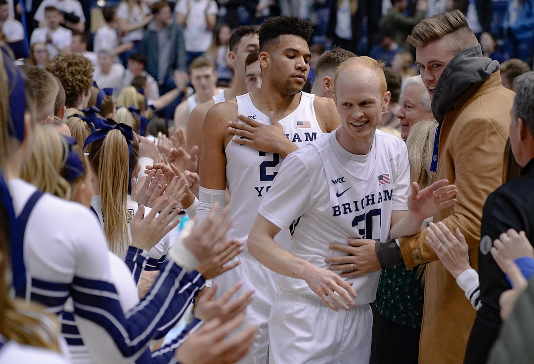 (Francisco Kjolseth  |  The Salt Lake Tribune) Brigham Young Cougars forward Yoeli Childs (23) and Brigham Young Cougars guard TJ Haws (30) are celebrated following their 85-75 win over the Santa Clara Broncos at the Marriott Center in Provo, Thursday, Feb. 20, 2020. 