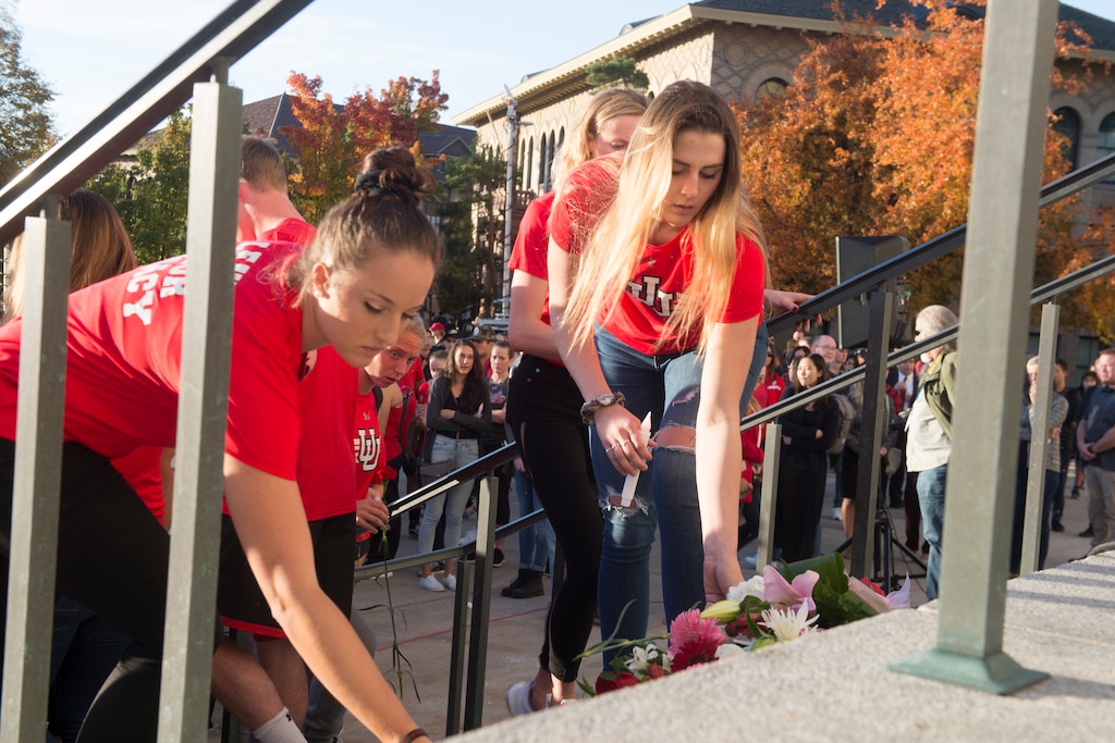 (Jeremy Harmon  |  The Salt Lake Tribune) Students leave flowers on the steps of the Park Building at the University of Utah following a vigil for Lauren McCluskey on Wed. Oct 24, 2018. McCluskey was killed on campus on Monday.