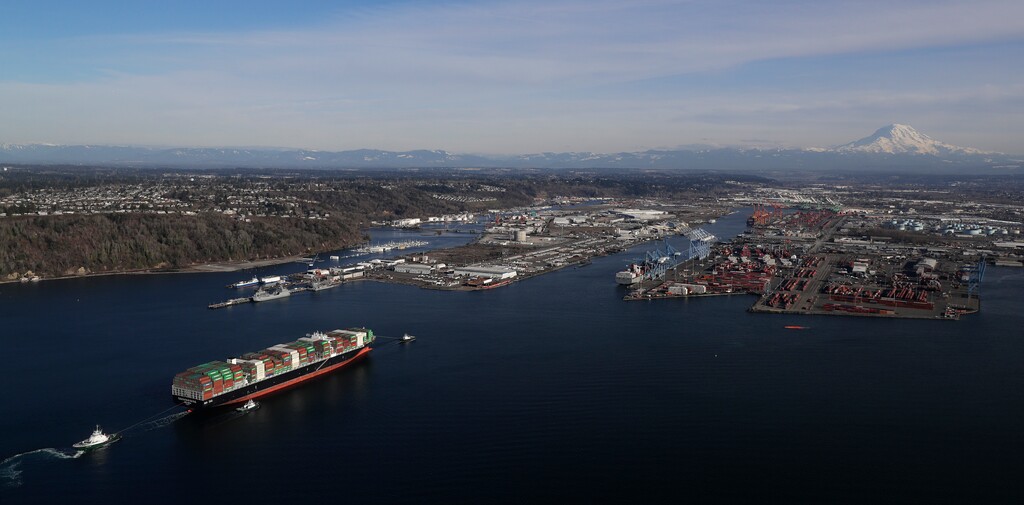 FILE- In this Tuesday, March 5, 2019, file photo the Cape Kortia container ship heads into the Port of Tacoma in Commencement Bay. The U.S. trade deficit jumped nearly 19 percent in December, pushing the trade imbalance for all of 2018 to widen to a decade-long high of $621 billion. The gap with China on goods widened to an all-time record of $419.2 billion. (AP Photo/Ted S. Warren, File)