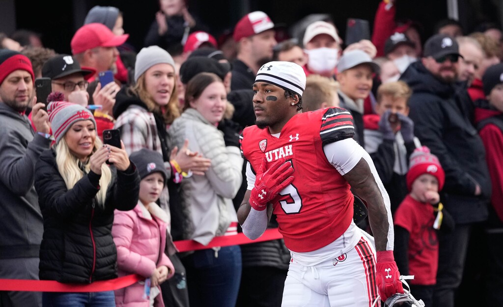 (Francisco Kjolseth | The Salt Lake Tribune) Utah Utes Junior running back TJ Pledger (5) joins in the University of Utah's senior day festivities before the Utes host the University of Colorado on Friday, Nov. 26, 2021 at Rice-Eccles Stadium.