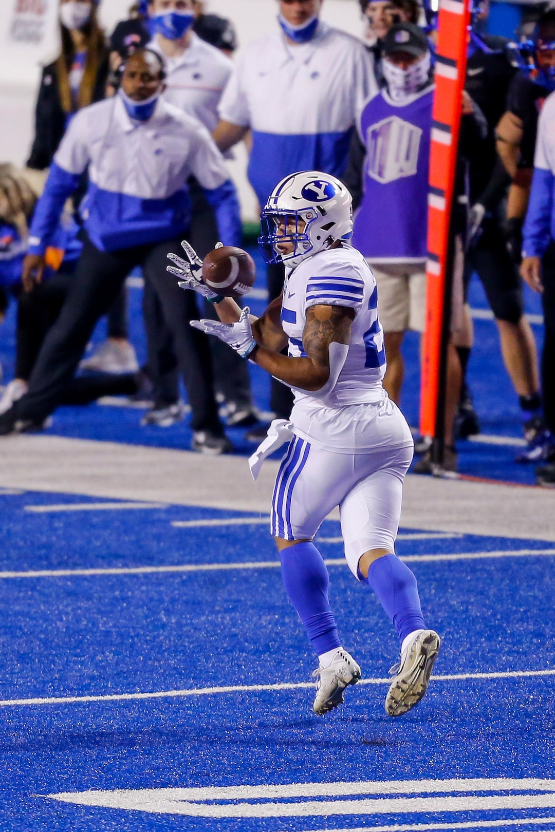 BYU running back Tyler Allgeier (25) turns to catch the ball during the first half against Boise State in an NCAA college football game Friday, Nov. 6, 2020, in Boise, Idaho. (AP Photo/Steve Conner)