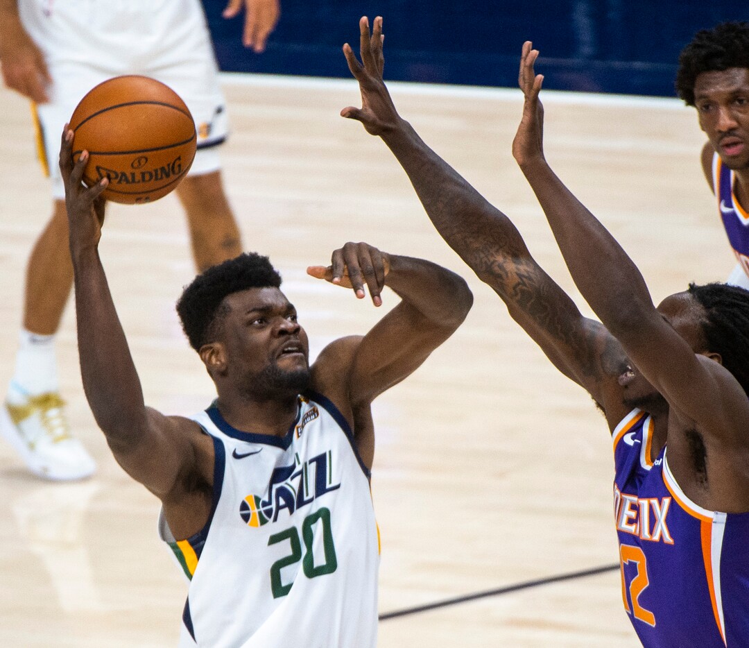 (Rick Egan | The Salt Lake Tribune)  Utah Jazz center Udoka Azubuike (20) shoots over Phoenix Suns forward, Johnathan Motley (12), in preseason NBA action between Utah Jazz and Phoenix Suns at Vivint SmartHome Area, on Saturday, Dec. 12, 2020.