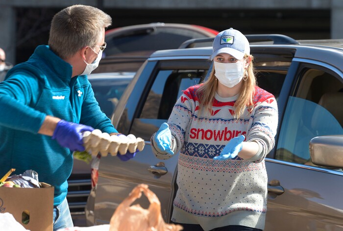 (Leah Hogsten  |  The Salt Lake Tribune)  Snowbird employees handed out over 10,000 pounds of perishable items from the ski resort's restaurants and stores to their workforce, March 21, 2020. The food included milk, eggs, bread, cheeses, every kind of herb, vegetable and fruit, including kumquats and lemon grass, and was given to Snowbird employees on a first-come, first-served basis.