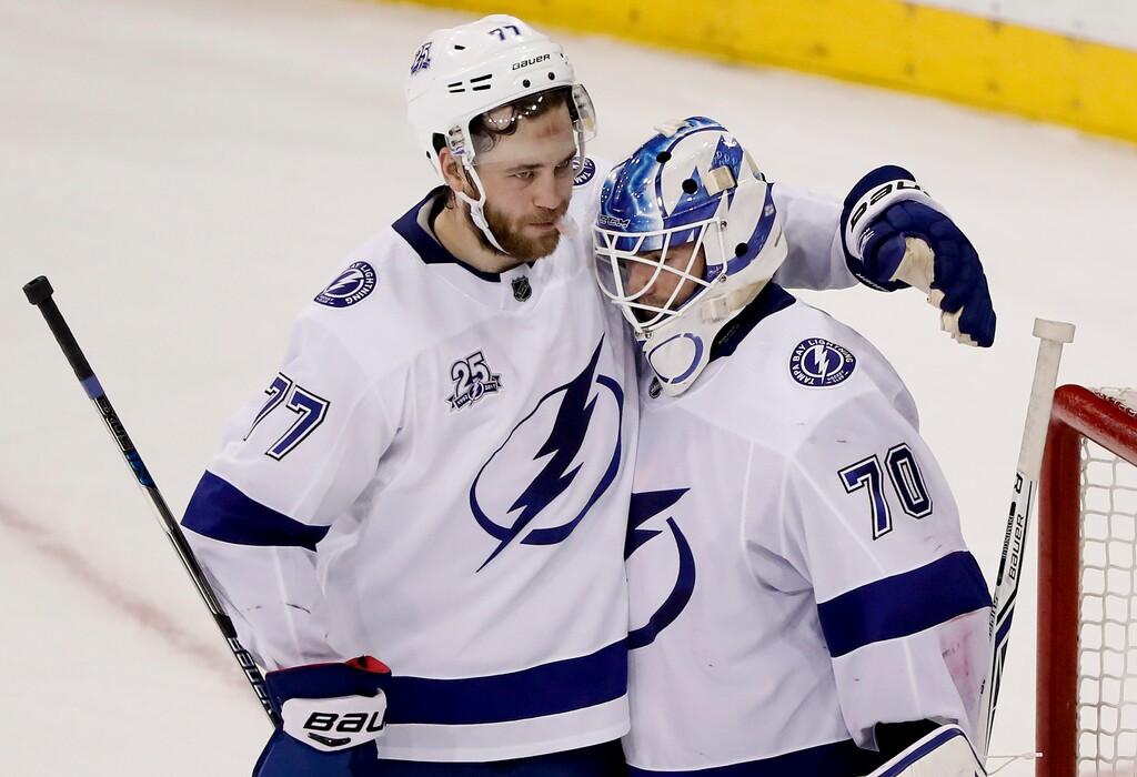 Tampa Bay Lightning defenseman Victor Hedman (77) celebrates with goaltender Louis Domingue (70) after the Lightning beat the New York Rangers in an NHL hockey game, Friday, March 30, 2018, in New York. (AP Photo/Julie Jacobson)