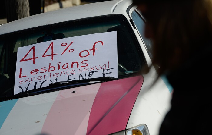 (Francisco Kjolseth | The Salt Lake Tribune) Activists in Utah gather outside of Salt City Tattoo on Friday, Dec. 22, 2017, to protest following an Instagram post made by the shop's official Instagram account. The post in question was of a gift provided during the shop's white elephant exchange, a gift one of the artists at the parlor called a "rape kit," containing leather gloves, black duct tape, a bottle of lubricant, rope, and a knife.