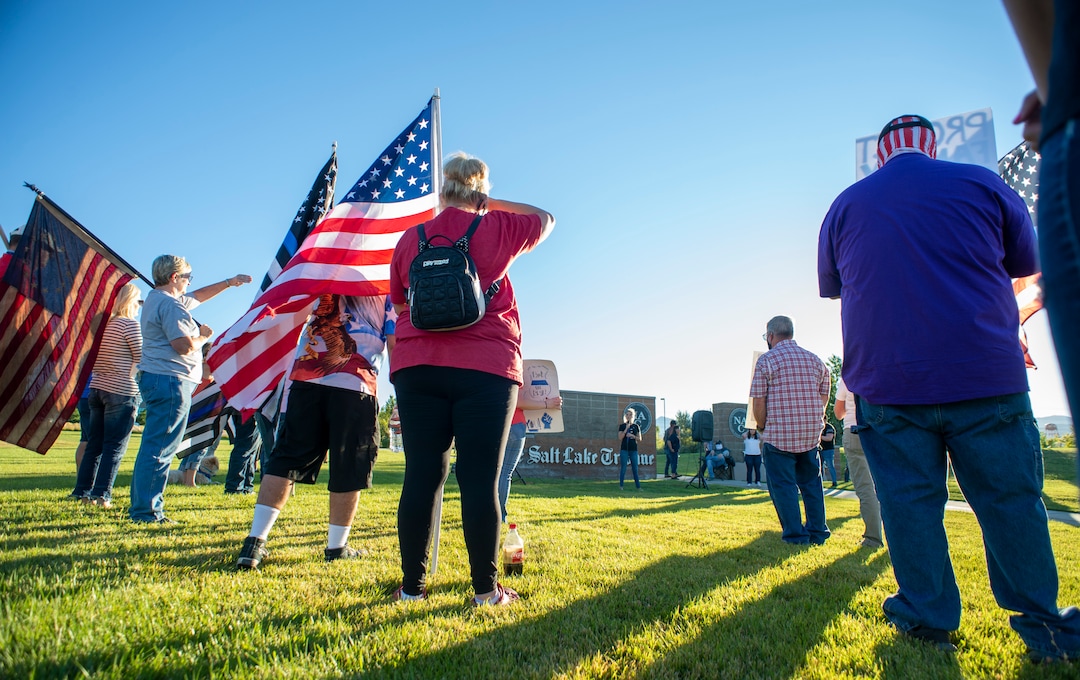 (Rick Egan  |  The Salt Lake Tribune)     Police supporters upset by a Pat Bagley cartoon, listen to Skye Christensen speak, as they protest The Salt Lake Tribune in West Valley City, on Thursday, Sept. 3, 2020.
