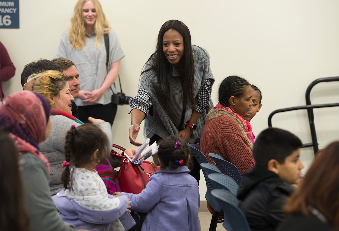 (Scott Sommerdorf   |  The Salt Lake Tribune)   Rep. Mia Love reaches out to shake the hand of a parent prior to a ceremony recognizing children who have obtained citizenship through their parents, Thursday, December 28, 2017. Some children were adopted by U.S. citizen parents; others derived citizenship when their immigrant parents became naturalized citizens.