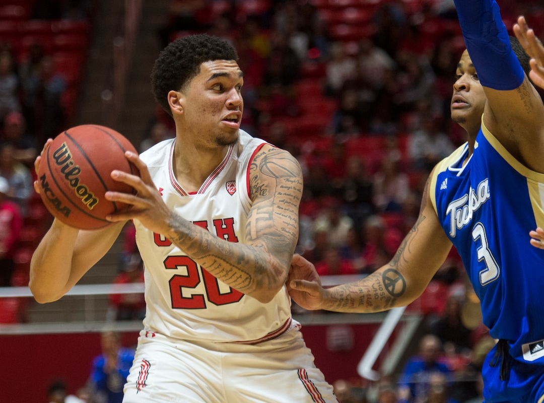 (Rick Egan  |  The Salt Lake Tribune)        Utah Utes forward Timmy Allen (20) works the ball, as Tulsa Golden Hurricane guard Elijah Joiner (3) defends, in basketball action between, Utah Utes and Tulsa Golden Hurricane, at the Jon M. Huntsman Center, Saturday, Dec. 1, 2018.