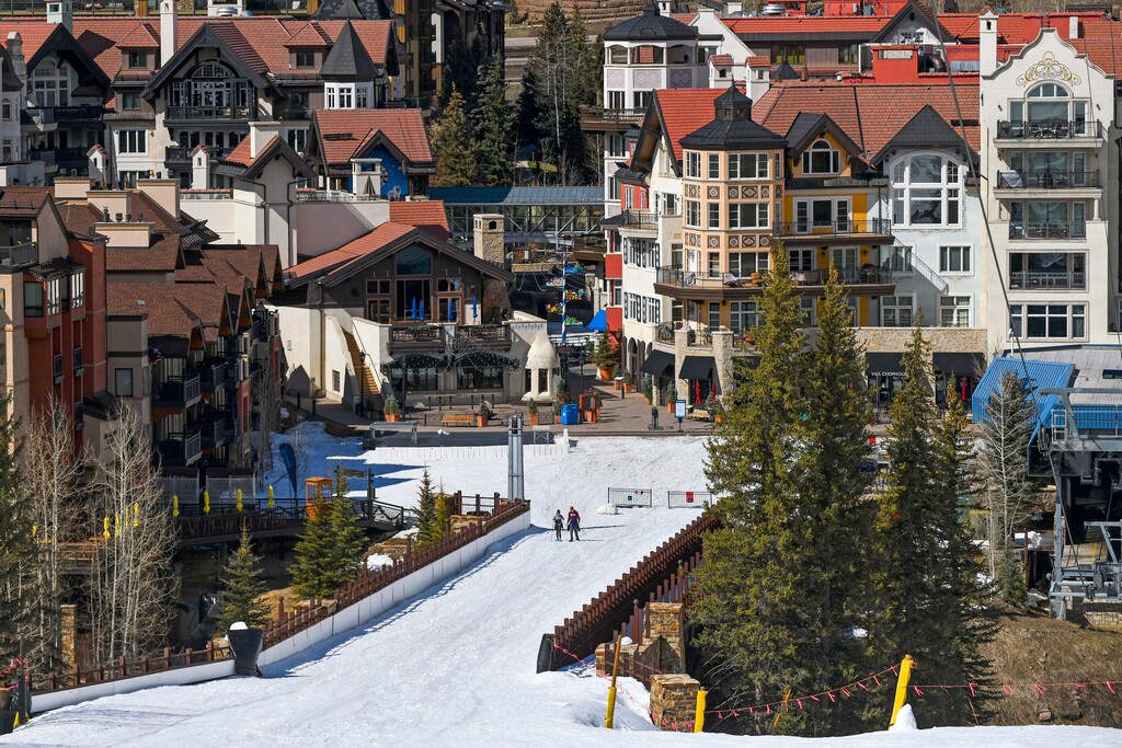 In this Tuesday, March 24, 2020, photo it is mostly deserted after the Vail Ski Resort closed for the season amid the COVID-19 pandemic, in Vail, Colo. Ski resorts across the West that were shut down amid coronavirus fears are grappling with an economic “body blow" at a time when they normally would be welcoming hoards of spring break revelers. (AP Photo/Michael Ciaglo)