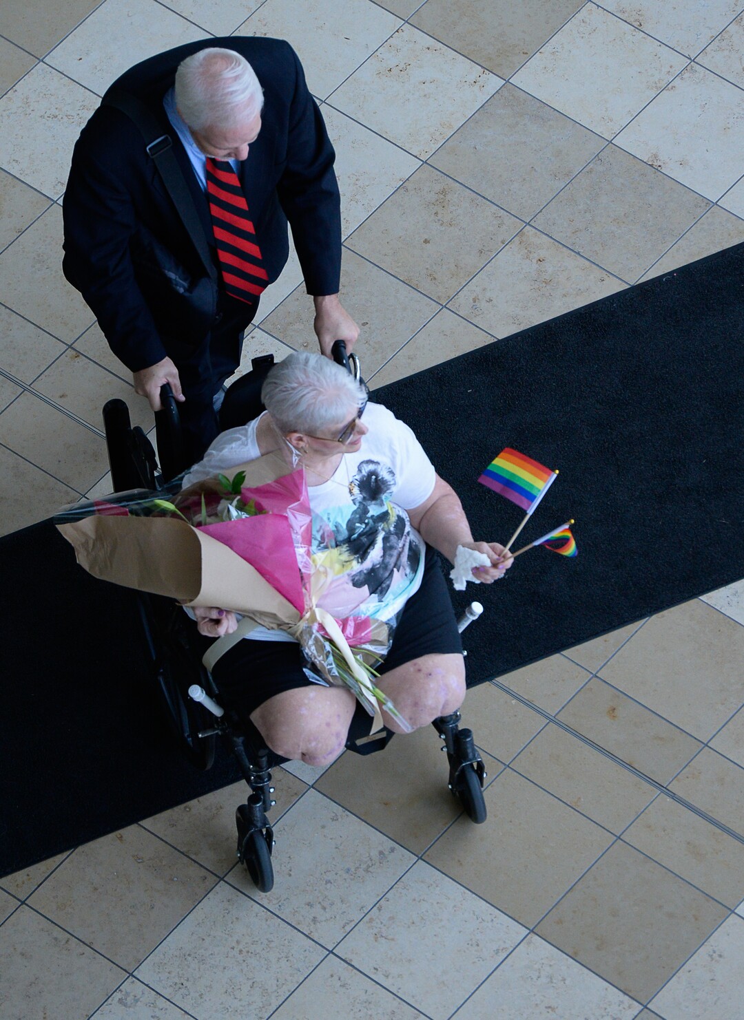 (Francisco Kjolseth  |  The Salt Lake Tribune)  Escorted by attorney Roger Hoole, at the Matheson Courthouse, Bonnie Foerster, 74, of South Salt Lake finally gets her wish of marrying her common-law partner of 50 years, Beverly Grossaint, even though she died on May 27 of this year. Foerster, who is legally blind and a double amputee shed tears of joy on Tuesday, Aug. 21, 2018, exclaiming "I can finally start healing," after a judge provided the legal recognition and allowed her to be legally married.