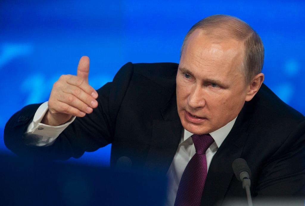 Russian President Vladimir Putin gestures during his annual news conference in Moscow, Russia, Thursday, Dec. 18, 2014.