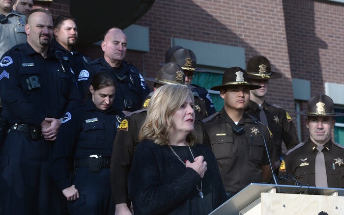 (Al Hartmann | The Salt Lake Tribune) Members of the South Jordan Police and Utah Highway Patrol stand with Jan McMillian at a press conference about the dangers of driving drunk on Thursday, Dec. 14, 2017. She described their family's loss when a drunken driver, who was driving the wrong direction on I-215, killed their adult son, Mikey, in 2015. South Jordan Police and the Utah Highway Patrol said that there will be increased patrols and enforcement over the holiday to catch drunken drivers.