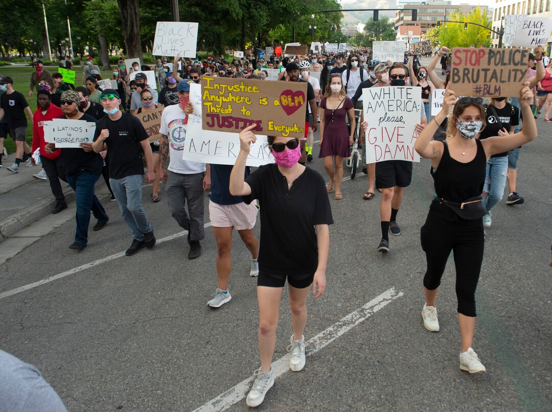 (Rick Egan  |  The Salt Lake Tribune)       Protesters walk between checkpoints on 200 East, during a demonstration in Salt Lake City, Tuesday, June 2, 2020.