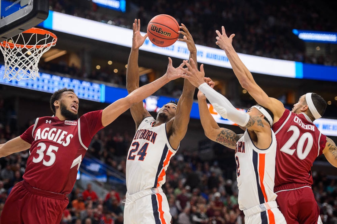 (Trent Nelson | The Salt Lake Tribune)  New Mexico State Aggies forward Johnny McCants (35), Auburn Tigers forward Anfernee McLemore (24), Auburn Tigers guard Bryce Brown (2) and New Mexico State Aggies guard Trevelin Queen (20) as Auburn faces New Mexico State in the 2019 NCAA Tournament in Salt Lake City on Thursday March 21, 2019.
