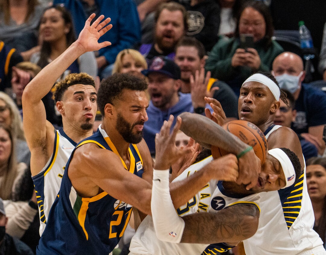 (Rick Egan | The Salt Lake Tribune) Utah Jazz center Rudy Gobert (27) goes for the ball along with Indiana Pacers forward Torrey Craig (13), in NBA action between the Utah Jazz and the Indiana Pacers at Vivint Arena, on Thursday, Nov. 11, 2021.
