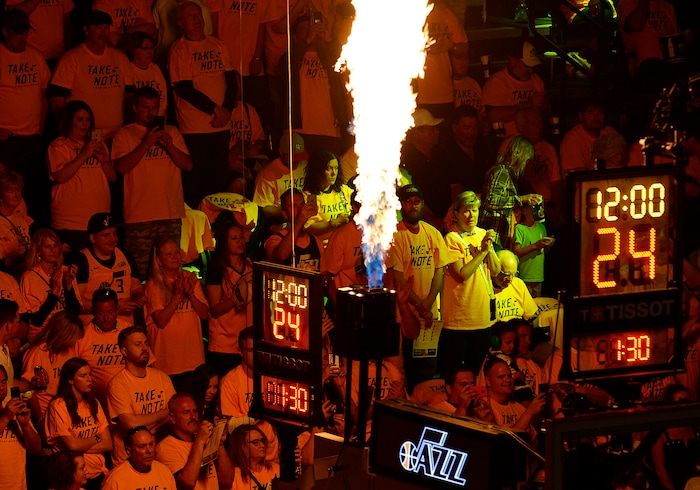 (Scott Sommerdorf | The Salt Lake Tribune)
Fans are illuminated by flames during pre-game introductions. The Rockets led the Jazz 58-48 at the half, Sunday, May 6, 2018.