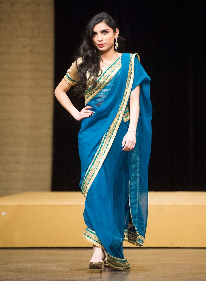 (Rick Egan  |  The Salt Lake Tribune)  Mesha  models a dress from Pakistanat the 8th Annual Women of the World Fashion Show. The fashion show fund is raiser for the non-profit that seeks to help refugees settle in a new culture. Wednesday, March 7, 2018.