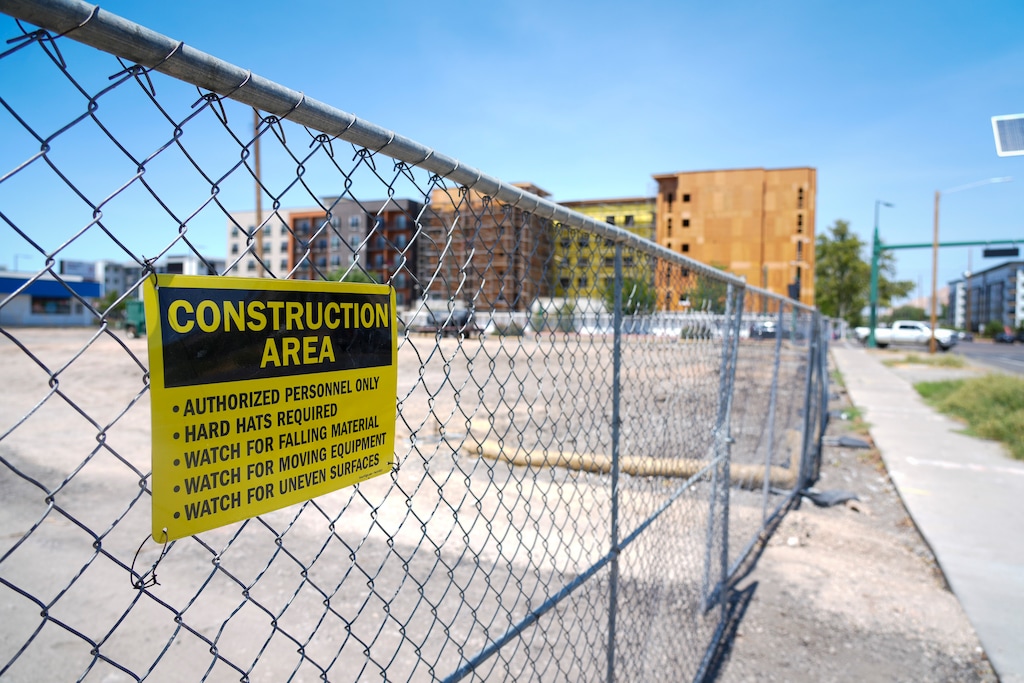 (Bethany Baker | The Salt Lake Tribune) A construction sign is posted on a chainlink fence along North Temple in Salt Lake City on Friday, July 25, 2025.